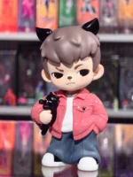 TNT Boy Rayan vinyl figure with brown hair, horns, and red outfit.