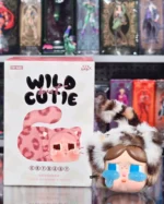 Crybaby vinyl plush pendant in a leopard-print fuzzy cat suit with oversized teary eyes